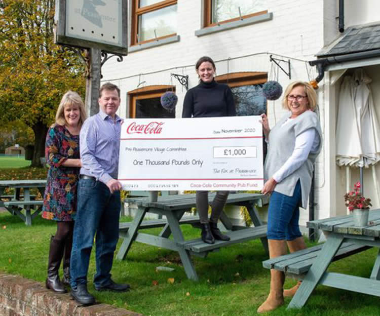 Cheque for the Peasemore village fund