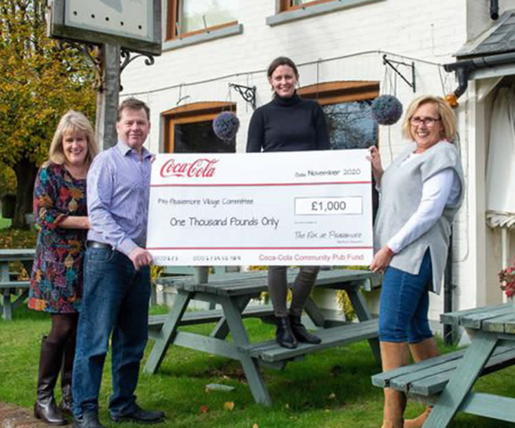 Cheque for the Peasemore village fund
