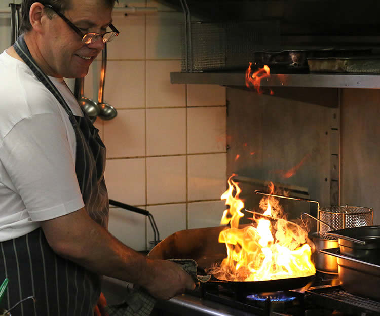 Phil Davison cooking in the pub kitchen